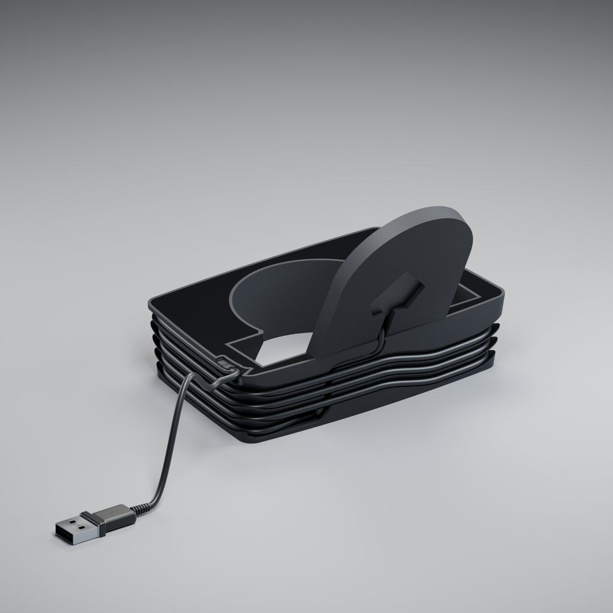 Rear view of assembled Puck Cup, showing the charger lead, wound cable and side exit beside the upright.