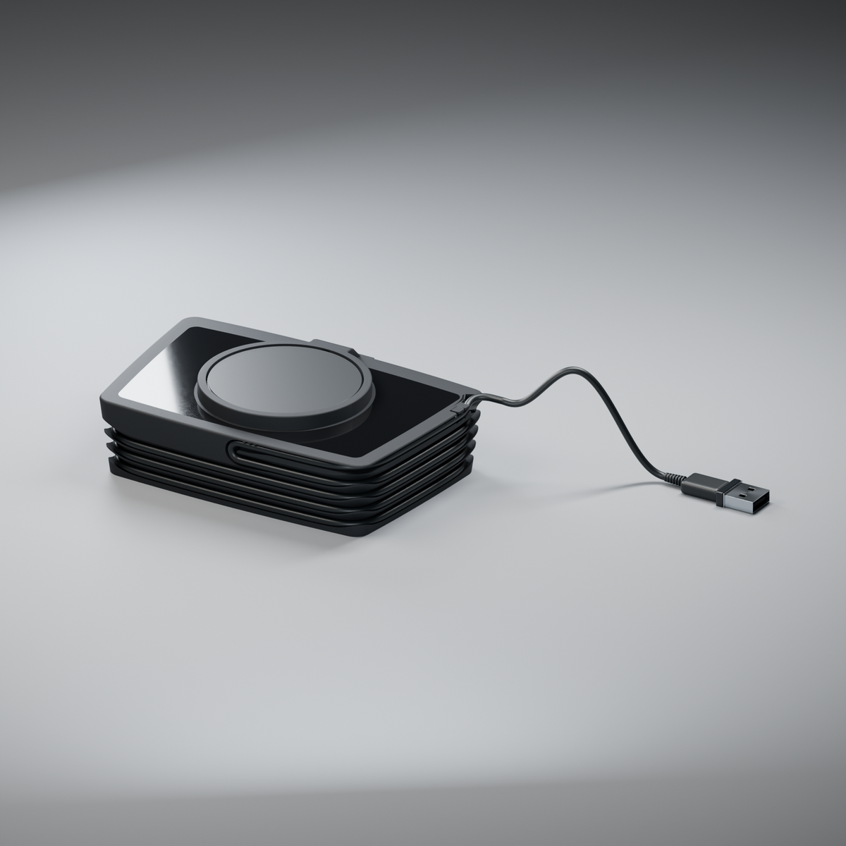 Flatboy assembled with a horizontal charging puck, glossy black acrylic surround, wound charging cable and USB-A plug.