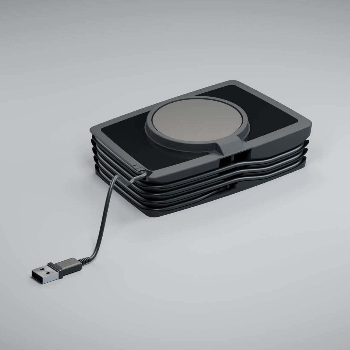 Rear of assembled Flatboy, showing the horizontal puck housing, covered cable entry, winding and USB-A lead.